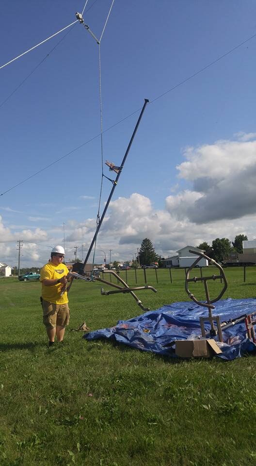 Jake raising an antenna mast on site